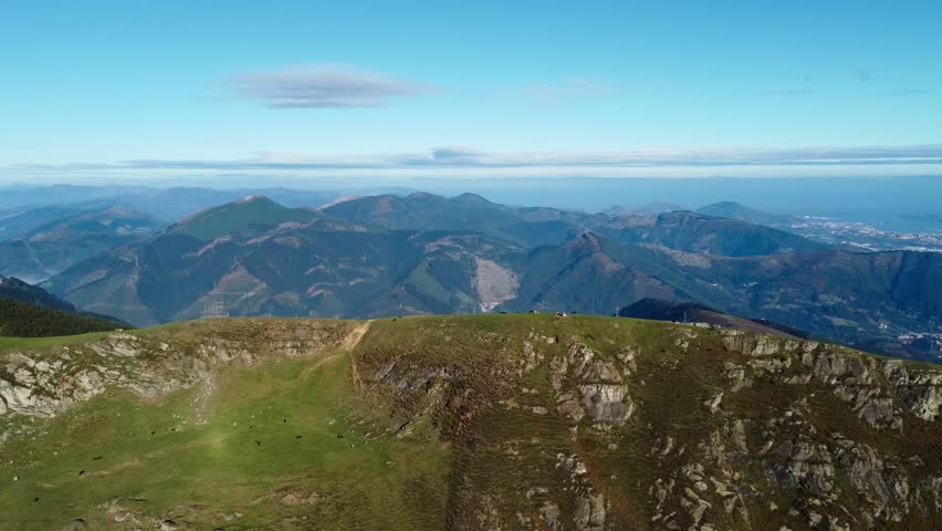 Drone view of the grassy, rocky peaks of Ganekogorta in the Basque Country, Spain, capturing the epic scale of the landscape.