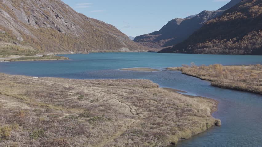 Glacier lake in Jotunheimen National Park. Autumn colors. Drone footage