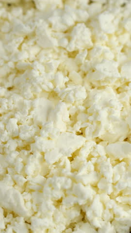 Bowl with Fresh cottage cheese close up, rotation
