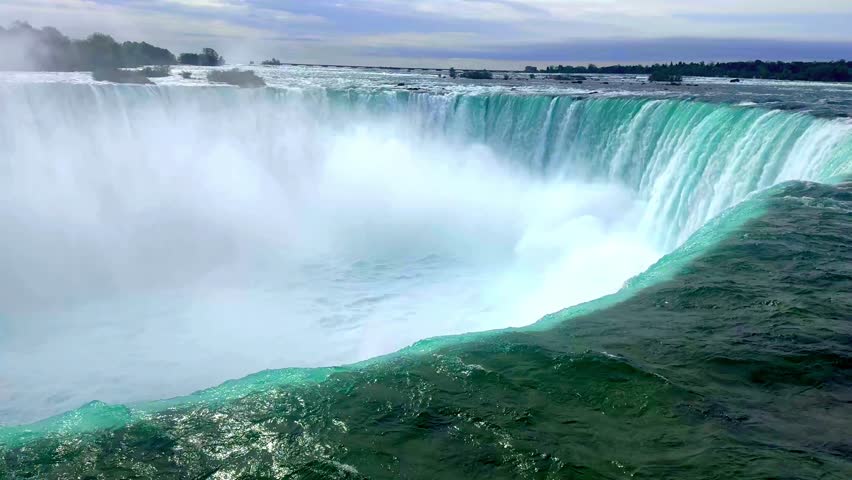 Niagara Falls in full flow, misty roaring waterfall