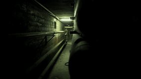 Dark and claustrophobic industrial corridor or tunnel with parallel pipes lining the walls, creating a spooky and mysterious atmosphere for a horror or thriller movie - Powered by Shutterstock - Get 15% off with code: PIKWIZARD15