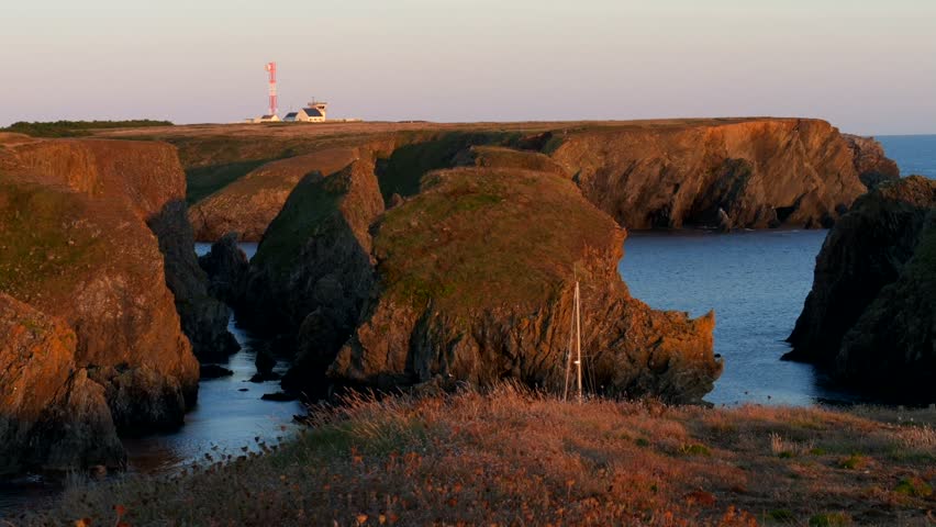 Beautiful rocks of Belle-Île at sunset. Slow motion 4K