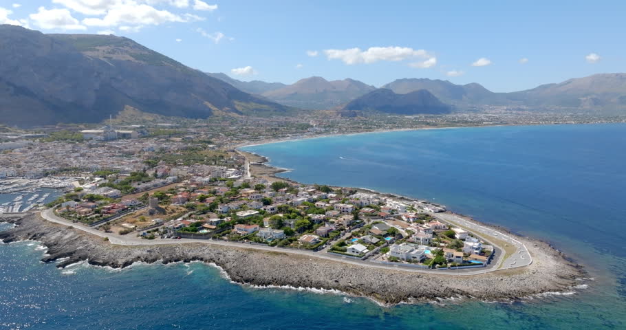 Aerial view of Isola delle Femmine (The Island of Females). It is a small town overlooking the Mediterranean Sea, located near Palermo, Sicily, Italy. In background is the large, long beach of Capaci.