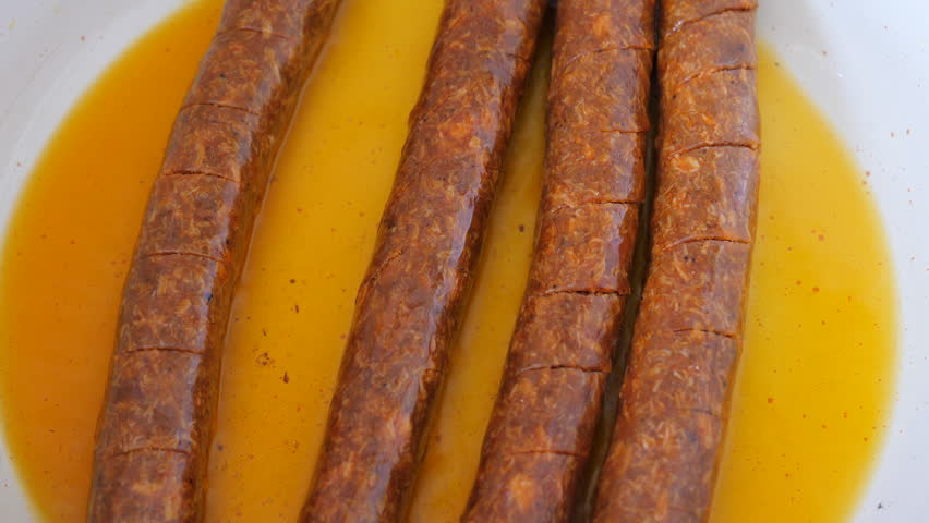 Barbeque sausages on the frying pan