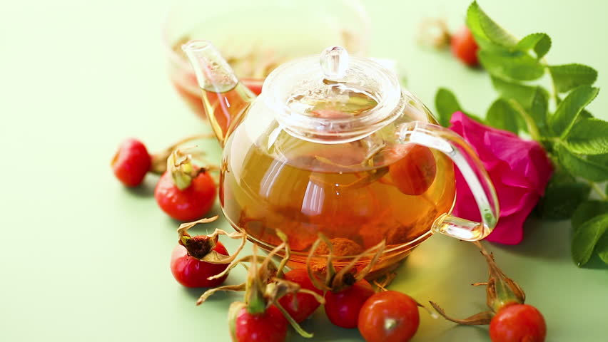 hot rosehip tea with flowers and berries
