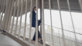 Blurred abstract image of businesswoman climbing stairs in city walkway. Concept of growth, personal journey, development, and forward movement in career. - Powered by Shutterstock - Get 15% off with code: PIKWIZARD15