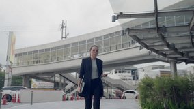 Busy Asian businesswoman looking at smartwatch while holding tablet and smartphone. Concept of multitasking, time management, and modern professional life. - Powered by Shutterstock - Get 15% off with code: PIKWIZARD15