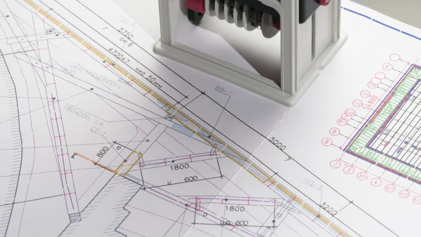 Approval of Design Drawings. A stamp is placed on the design drawing and leaves an ink imprint symbolizing compliance with standards and building permission