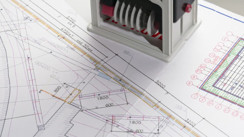 Approval of Design Drawings. A stamp is placed on the design drawing and leaves an ink imprint symbolizing compliance with standards and building permission