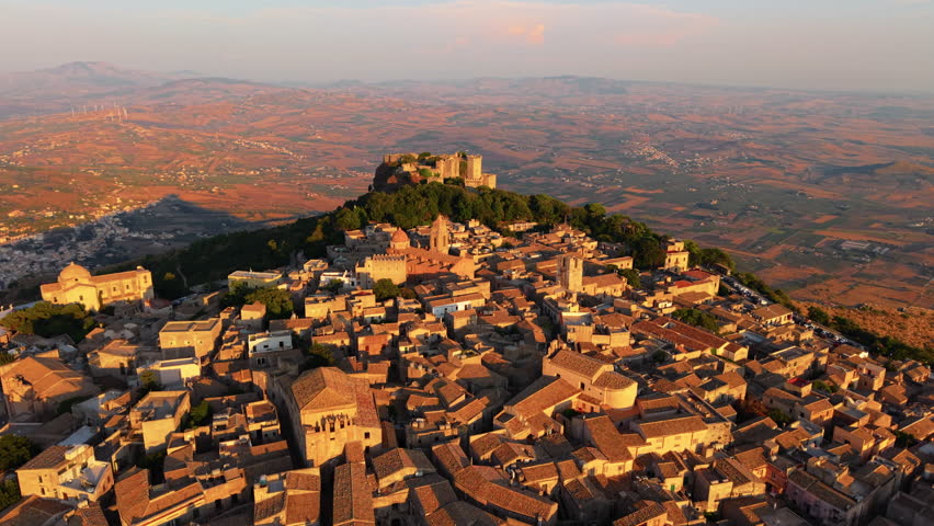 Erice Village And Castle of Venus During Golden Hour In Sicily, Italy. - aerial shot