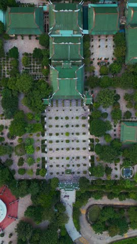 religious Lady Buddha monument at Linh Ung pagoda and buddhism temple, Asian religion and spirituality, Son Tra peninsula, Da Nang, Vietnam 4k aerial drone view, vertical video