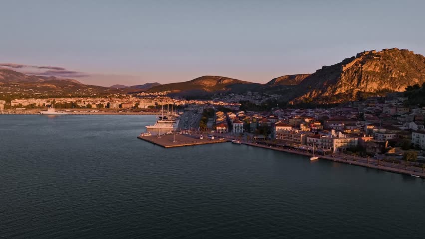 Aerial view of the fortress of Palamidi standing tall over the city, a contrast of ancient stone and modern buildings, Nafplion, Argolis, Greece.