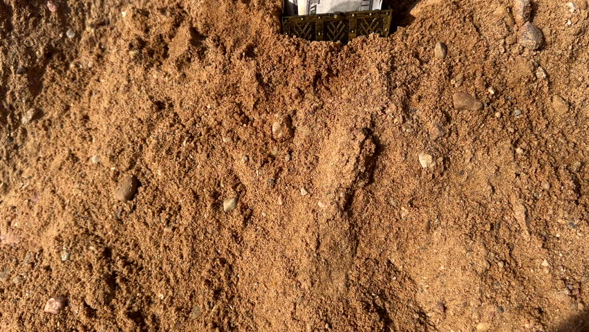 Skull at Treasure Chest Filled With Rolled Cash Discovered. Human skull with treasure chest buried in sand, revealing bundles of Dollars Cash. Hide money. Skeleton of treasure hunter with money.