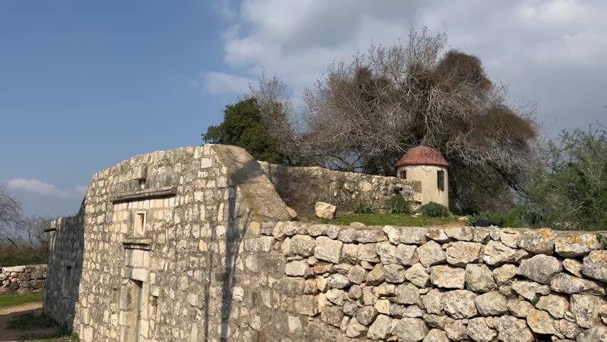 Ancient fortifications and abandoned stone church ruins on Mount Tabor in Israel.