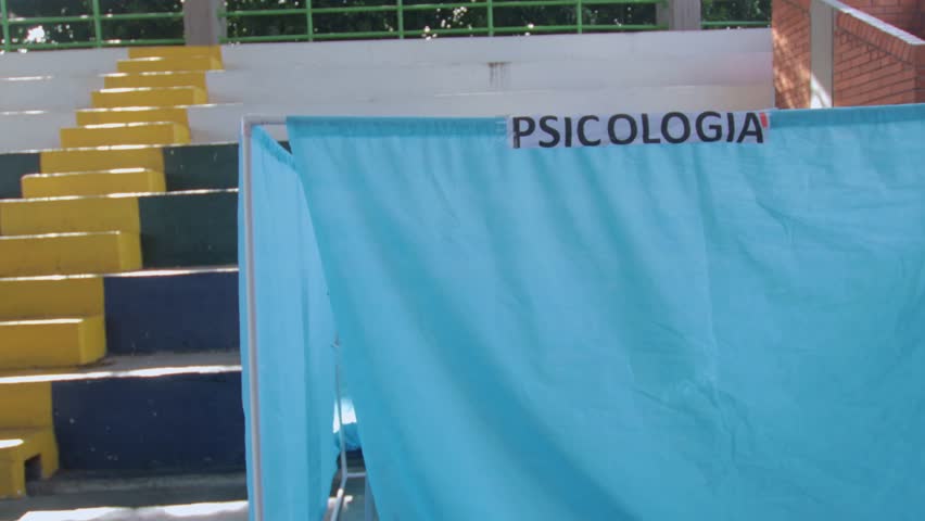 A woman receiving psychological treatment during a community health outreach event in a rural Colombian town.