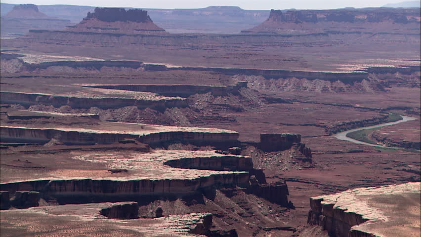 Pan view of large river and cliff