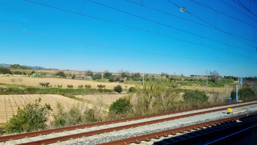 Scenic Railway Landscape with Blue Sky and Countryside View