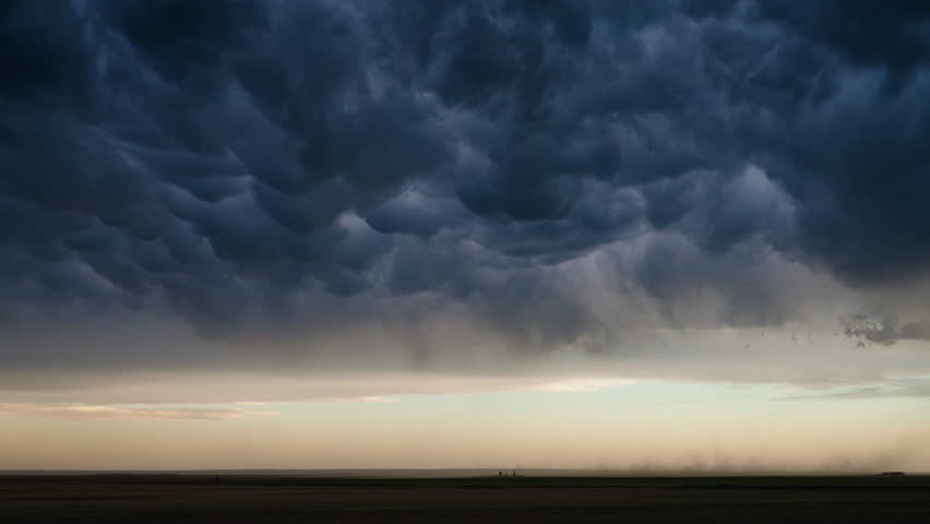 Time lapse captures overcast skies building into a thunderstorm across the plains, showcasing dramatic cloud motion, atmospheric tension, and nature’s evolving power