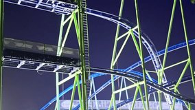 A Vibrant and Exciting Nighttime Roller Coaster Structure Located in the Amusement Park - Powered by Shutterstock - Get 15% off with code: PIKWIZARD15