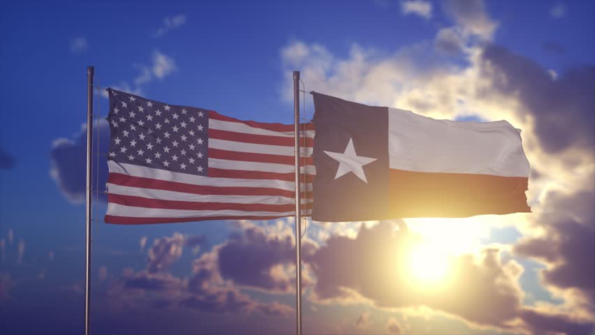 Waving Flags of United States and Texas Against Sunset Sky