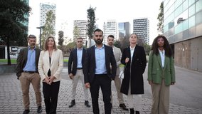 A diverse team of confident businesspeople strides forward, showcasing their professionalism and unity. Each member wears formal attire, embodying a strong partnership and commitment to success. - Powered by Shutterstock - Get 15% off with code: PIKWIZARD15