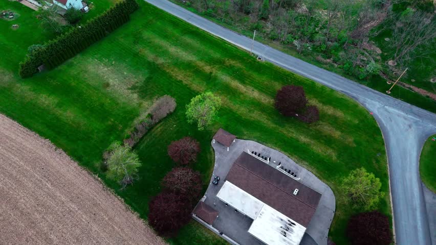 Aerial top down of corn fields and farmland mountains in rural Appalachia Central Pennsylvania USA