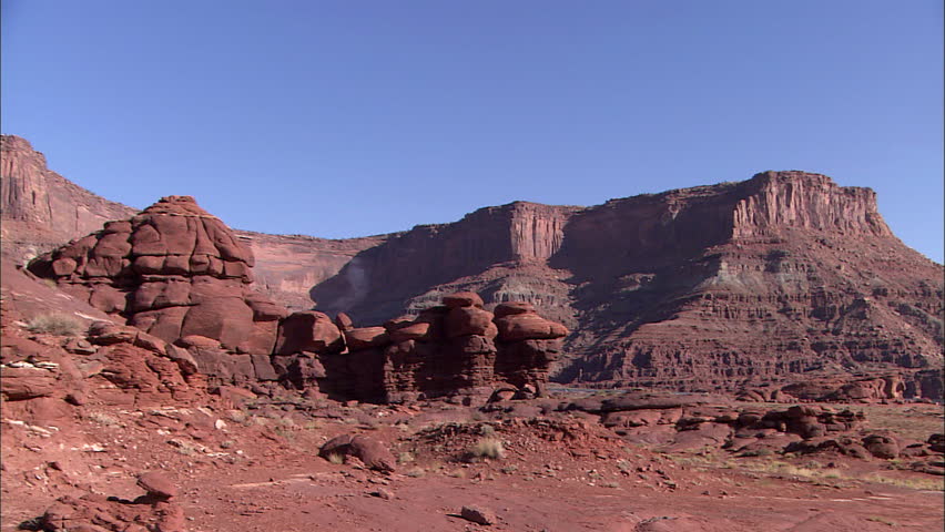 Pan across wide landscape of Canyonlands