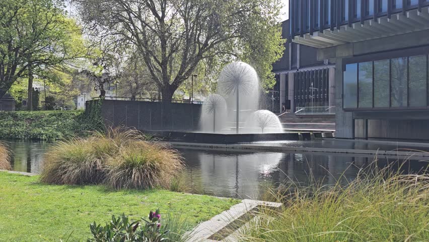 A still video capturing the dandelion-style fountain in downtown Christchurch, New Zealand. Water sprays gracefully from the sculptural spheres shimmering in the sunlight while reflecting on the river
