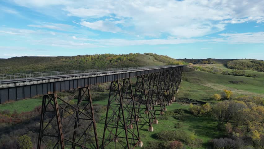 Uno Trestle Bridge and VIA Rail The Canadian in fall drone aerial