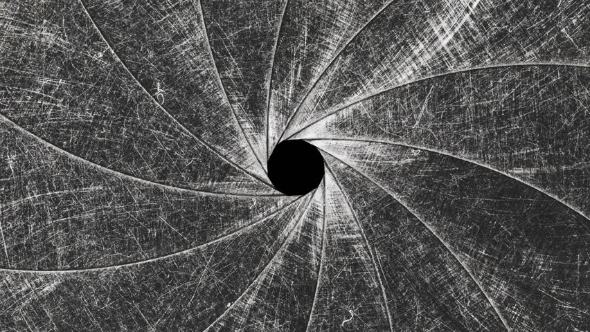 Stop motion of a mechanical iris of a camera lens is the opening mechanism that controls the aperture. Circular blades that create a precision opening controlling amount of light and the depth of fiel