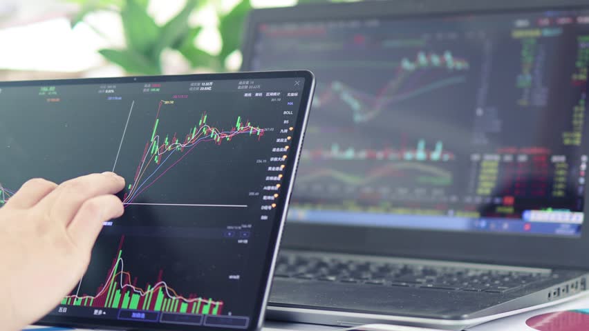 Man browsing and analyzing stock quotes on tablet