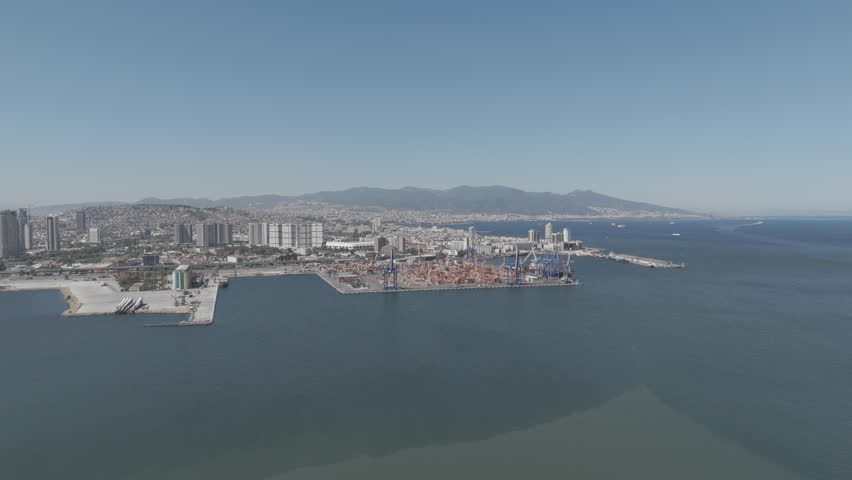 D-Log M. Izmir, Turkey.Aerial view of Izmir Port container terminal with stacking area and large cranes for cargo operations on sunny summer day. Aerial view.