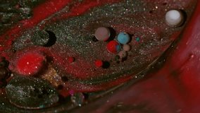 Shimmer spill. Paint water. Defocused red blue colorful droplet glitter oil acrylic liquid floating on abstract black dark background. - Powered by Shutterstock - Get 15% off with code: PIKWIZARD15
