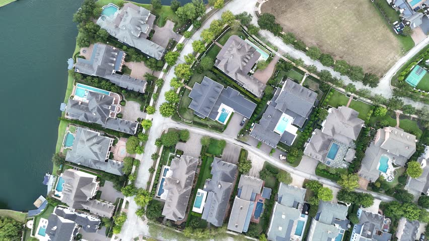 Aerial view of luxury houses in Houston, Woodlands by the lake with swimming pools in Texas, United States