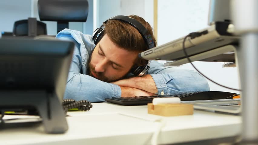 Animation of digital icons and data processing over caucasian man sleeping on his desk at office. Computer interface and business technology concept - Powered by Shutterstock - Get 15% off with code: PIKWIZARD15