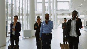 Animation of connected icons with lines, diverse coworkers with phone and luggage walking at airport. Digital composite, multiple exposure, communication, business travel and teamwork concept. - Powered by Shutterstock - Get 15% off with code: PIKWIZARD15