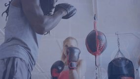 The trainer is teaching the female boxer how to stay in shape and improve her boxing skills in the fitness studio. Global business connections digital interface and technology concept digitally - Powered by Shutterstock - Get 15% off with code: PIKWIZARD15