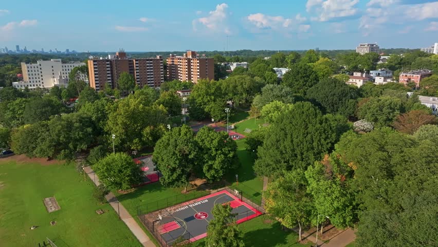 Basketball court in Central Park in Fourth West neighbourhood, Atlanta city urban park and playground, Georgia, Aerial