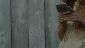 Woman tapping smartphone, pulsing hexagon revealing lock icon, sending data for secure transmission. Technology, cybersecurity, digital, innovation, mobile, protection, privacy - Powered by Shutterstock - Get 15% off with code: PIKWIZARD15