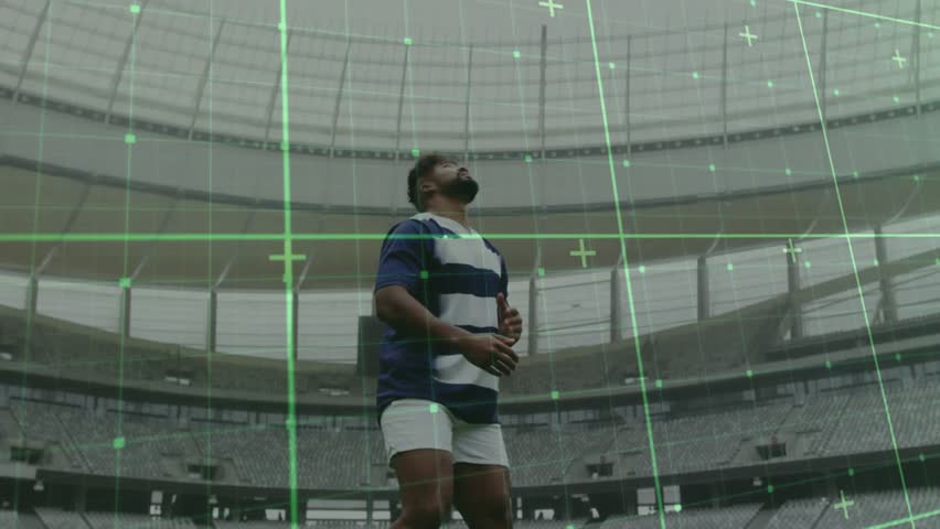 Male rugby player tracking green grid activating, anticipating drop, catching ball and running. Athlete, stadium, motion capture, digital technology, sports performance, training, competition