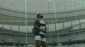 Male rugby player tracking green grid activating, anticipating drop, catching ball and running. Athlete, stadium, motion capture, digital technology, sports performance, training, competition - Powered by Shutterstock - Get 15% off with code: PIKWIZARD15