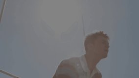 Man wearing rugby shirt looking up tossing ball causing tech code overlaying glass wall celebrating. Innovation, ambition, technology, inspiration, motivation, futurism, teamwork - Powered by Shutterstock - Get 15% off with code: PIKWIZARD15