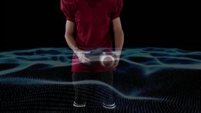 Male athlete in red jersey lifting football amid waves settling with blue tech grid pulsing waist. Athlete, sports, technology, digital, motion, dynamic, performance - Powered by Shutterstock - Get 15% off with code: PIKWIZARD15