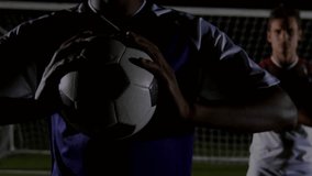 Forward gripping soccer ball initiating 3D grid and animating metrics for sports analytics. Athletes, sports analytics, digital visualization, performance metrics, competition, night game, stadium - Powered by Shutterstock - Get 15% off with code: PIKWIZARD15