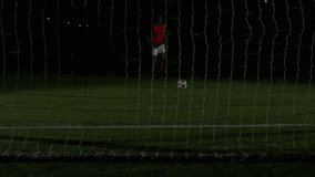 Data overlay graphs appearing on goal net guiding soccer player kicking ball for sports analytics. Athlete, performance, digital, visualization, sport, outdoor, innovation - Powered by Shutterstock - Get 15% off with code: PIKWIZARD15