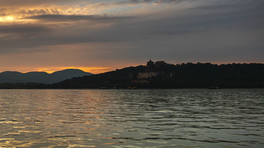 Stunning sunset over Kunming Lake and the Tower of Buddhist Incense at the Summer Palace, Beijing, China