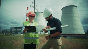 Engineer In Hard Hat Looking At Power Plant, Professional Industrial Worker With Blueprints. Factory Site Inspection, Energy Production. Sustainable Technology, Engineering Expertise. Technical Skills - Powered by Shutterstock - Get 15% off with code: PIKWIZARD15