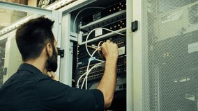 System Engineer Control Room IT Administrator. Server Engineer Work On Laptop in Data Center. Male Server IT Engineer Work Data Center. Man Work In Server Room. Male Typing On Laptop In Server Room - Powered by Shutterstock - Get 15% off with code: PIKWIZARD15