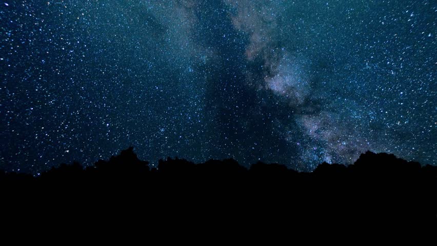 Milky Way galaxy over mountain silhouette at night. stunning starry sky with countless shining stars, cosmic landscape, deep space background and breathtaking photography universe. Time Lapse Nebula
