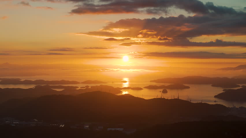 Cinematic aerial shot of sunrise at Seto inland sea in Hiroshima prefecture, Japan